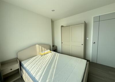 Bright bedroom with a double bed and wardrobe