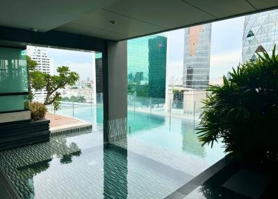 Outdoor pool area with city view
