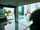 Outdoor pool area with city view