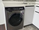 Modern kitchen with built-in washer and sleek countertop