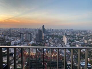 City view from balcony at sunset