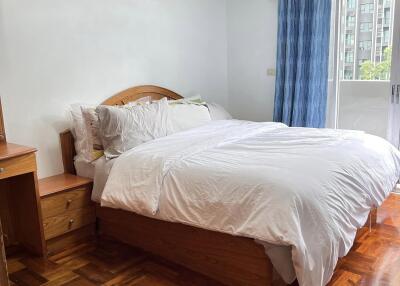 bedroom with a large bed and natural light