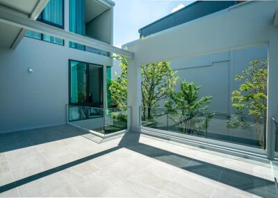 Modern patio with glass railing