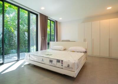 Bright and modern bedroom with large windows