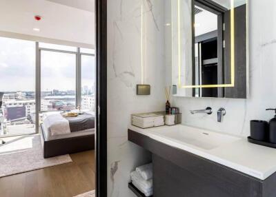 Modern bedroom and bathroom with city view