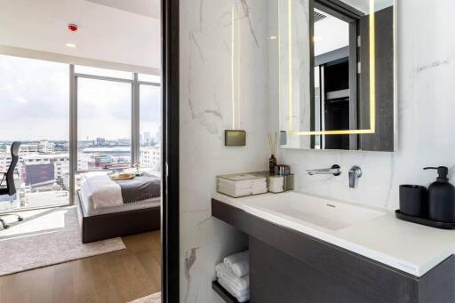 Modern bedroom and bathroom with city view