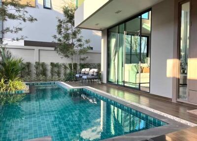 Outdoor pool area with seating and modern design