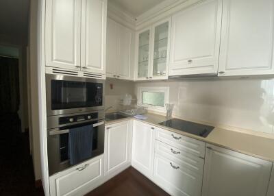 Modern white kitchen with built-in appliances