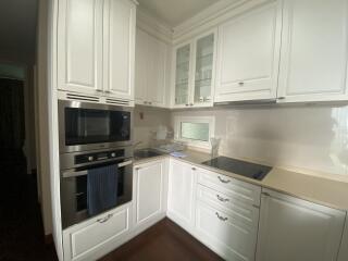 Modern white kitchen with built-in appliances