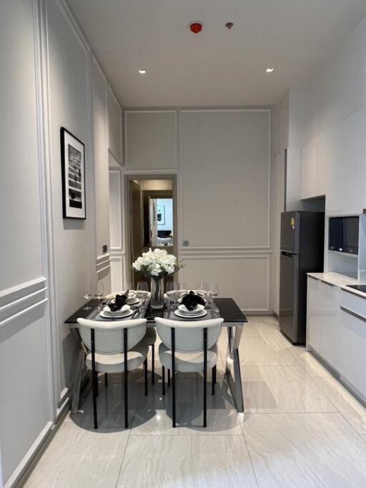 Modern dining area with a four-seater table and elegant setup