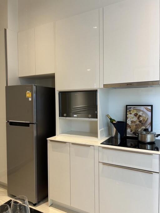 Modern kitchen with stainless steel appliances and white cabinets