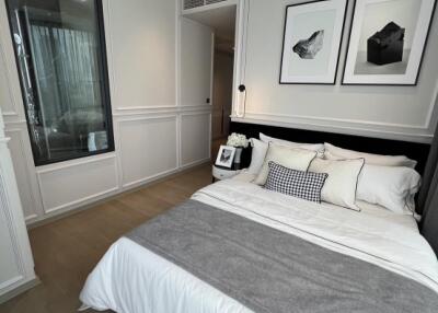 Modern bedroom with neutral decor and large bed