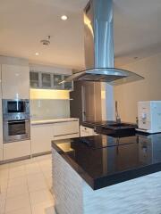 Modern kitchen with stainless steel appliances and island