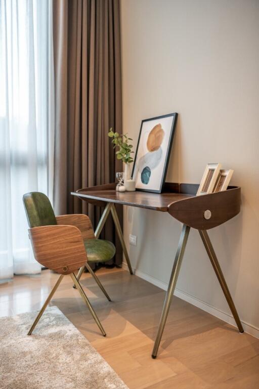 Modern home office with wooden desk and chair