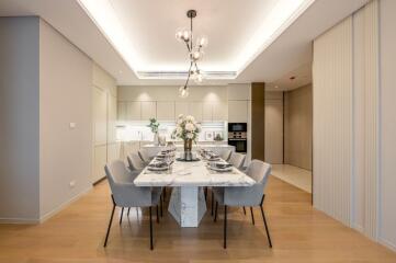 Modern dining room with marble table and elegant lighting