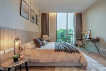 Modern bedroom with large window and natural light