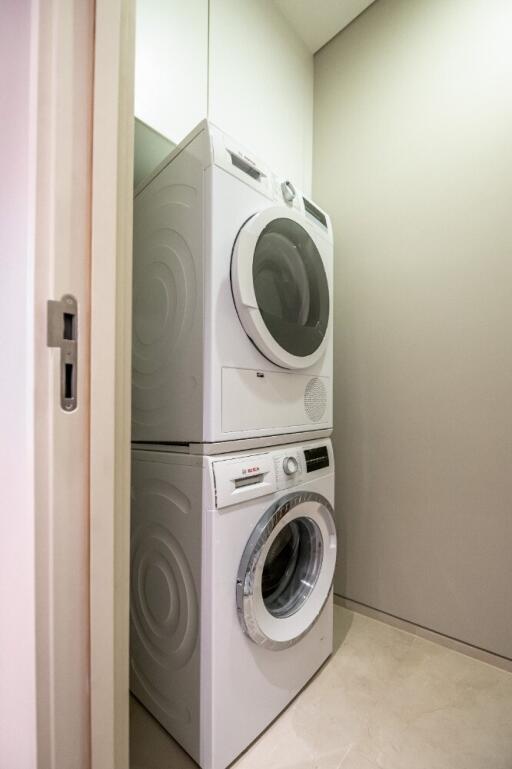 Stacked washer and dryer in a small laundry room