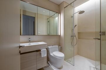 Modern bathroom with shower, toilet, and sink