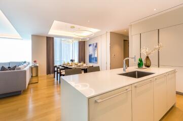 Open-concept living and dining area with modern kitchen island