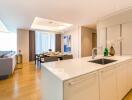 Open-concept living and dining area with modern kitchen island