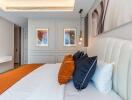 Modern bedroom with stylish decor and artwork