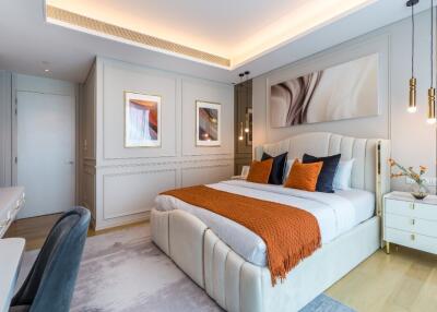 Modern bedroom interior with double bed, decorative pillows, and ambient lighting