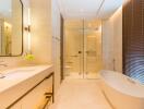 Modern bathroom with bathtub, shower, and large mirror