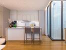 Modern kitchen with island and adjacent windows