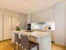 Modern kitchen with island and bar stools