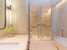 Modern bathroom with glass shower and bathtub