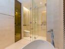 Modern bathroom with glass-enclosed shower and bathtub