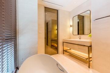 Modern bathroom with large mirror and vanity