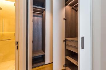 Well-lit closet with multiple shelves and drawers