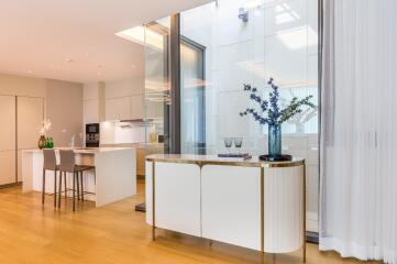 Modern open-plan kitchen with dining area and stylish decor