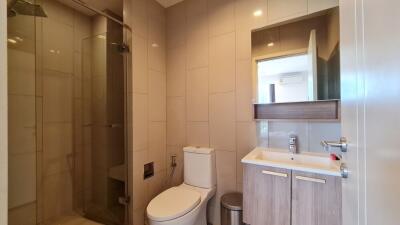 Modern bathroom with shower, toilet, and sink