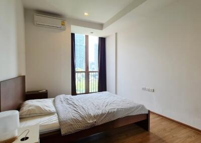 Modern bedroom with a large window