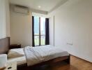 Modern bedroom with a large window