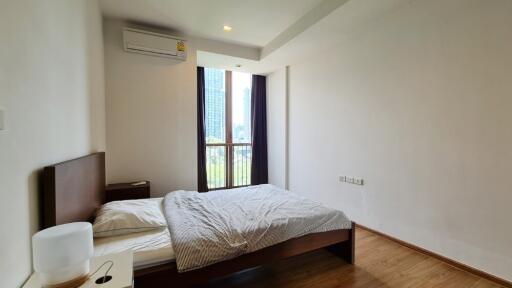 Modern bedroom with a large window