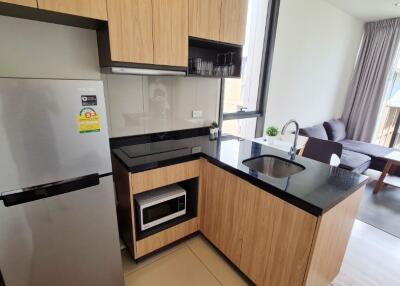 Modern kitchen area with adjacent living space