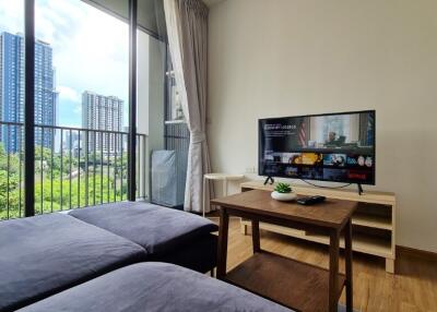 Modern living room with a view of city buildings