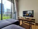 Modern living room with a view of city buildings