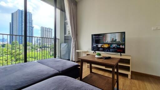 Modern living room with a view of city buildings