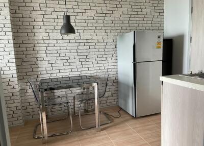 Modern kitchen with stainless steel appliances and dining area