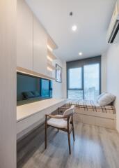 Modern bedroom with a study desk and large window