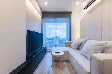 Modern living room with a large window and a view