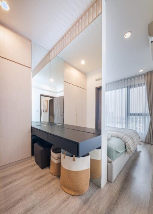 Modern bedroom with mirrored wardrobe and stylish decor