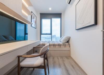 Modern bedroom with desk and large window