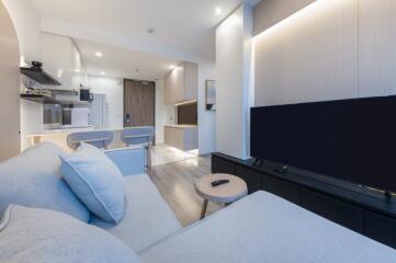 Modern living area with sofa and wall-mounted TV