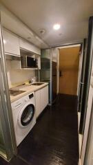 Compact kitchen with washing machine and microwave