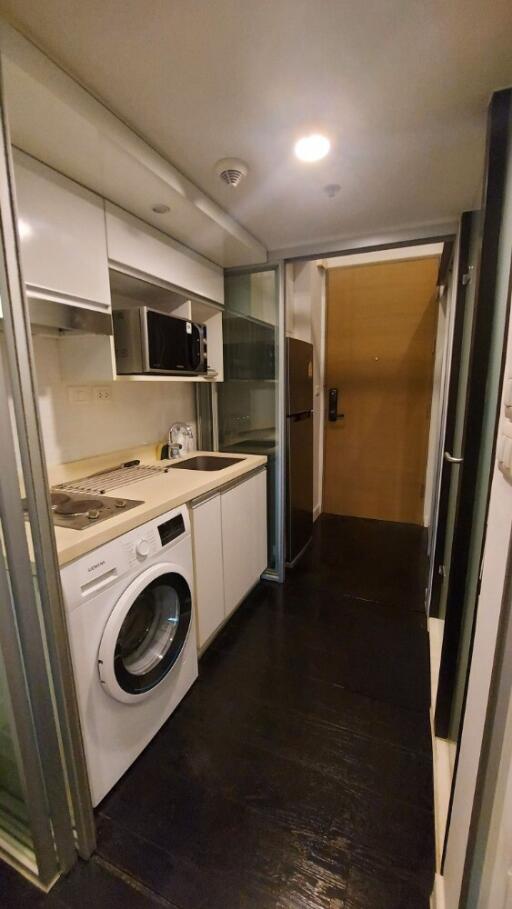 Compact kitchen with washing machine and microwave